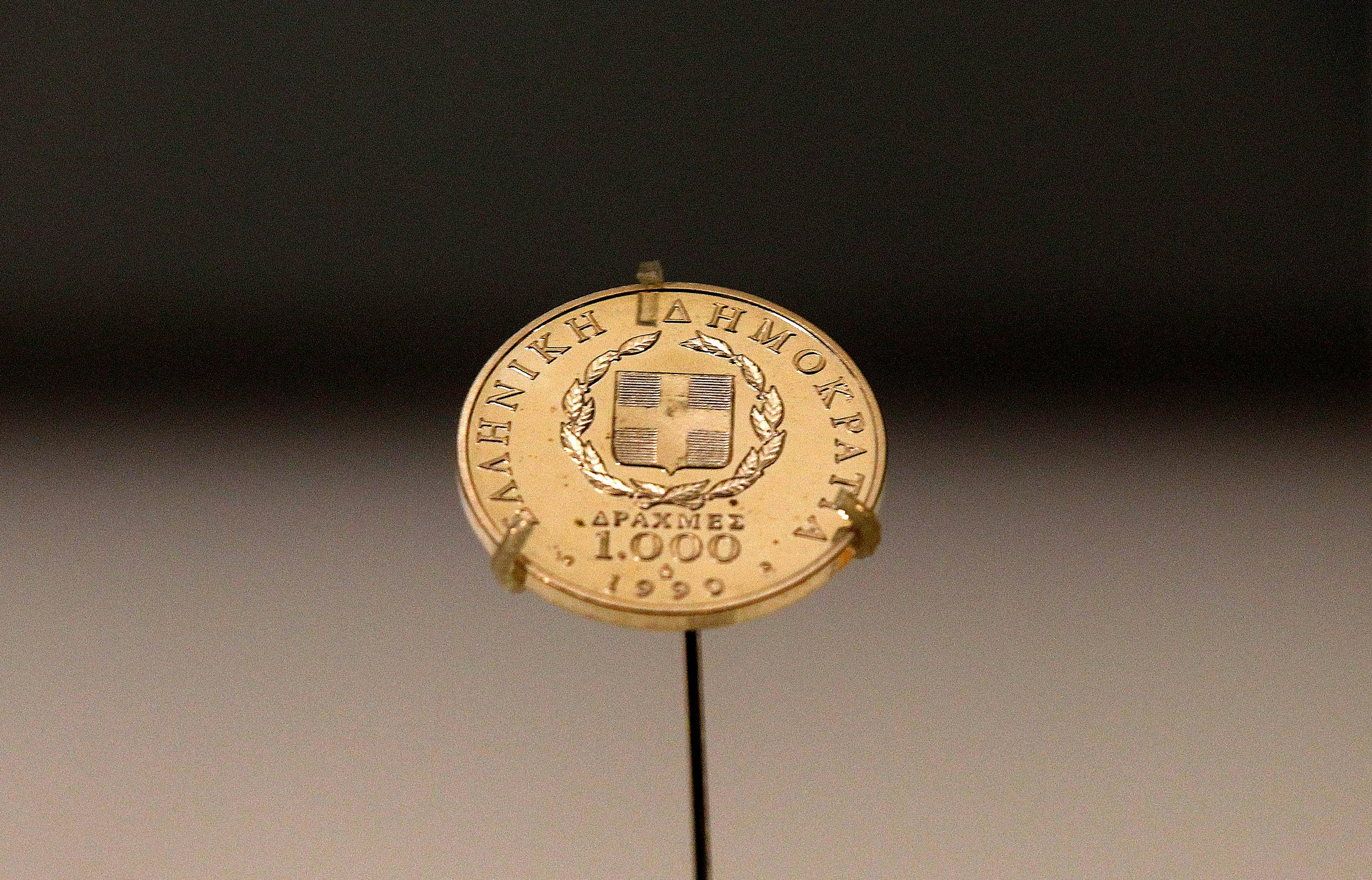 A Greek 1,000 drachma coin dating from 1999, sits on display in a secure cabinet at the Bank of Greece museum in Athens, Greece, on Tuesday, Feb. 14, 2012. European officials ratcheted up the pressure on the Greek government to deliver budget cuts in exchange for a second bailout as they insisted that default is not an option. Photographer: Simon Dawson/Bloomberg via Getty Images
138990488
AUSTERITY, BAILOUT, CURRECY; CURRENCIES, CUTS, ECONOMY, EMEA, EUROPE, FINANCE, FINANCIAL