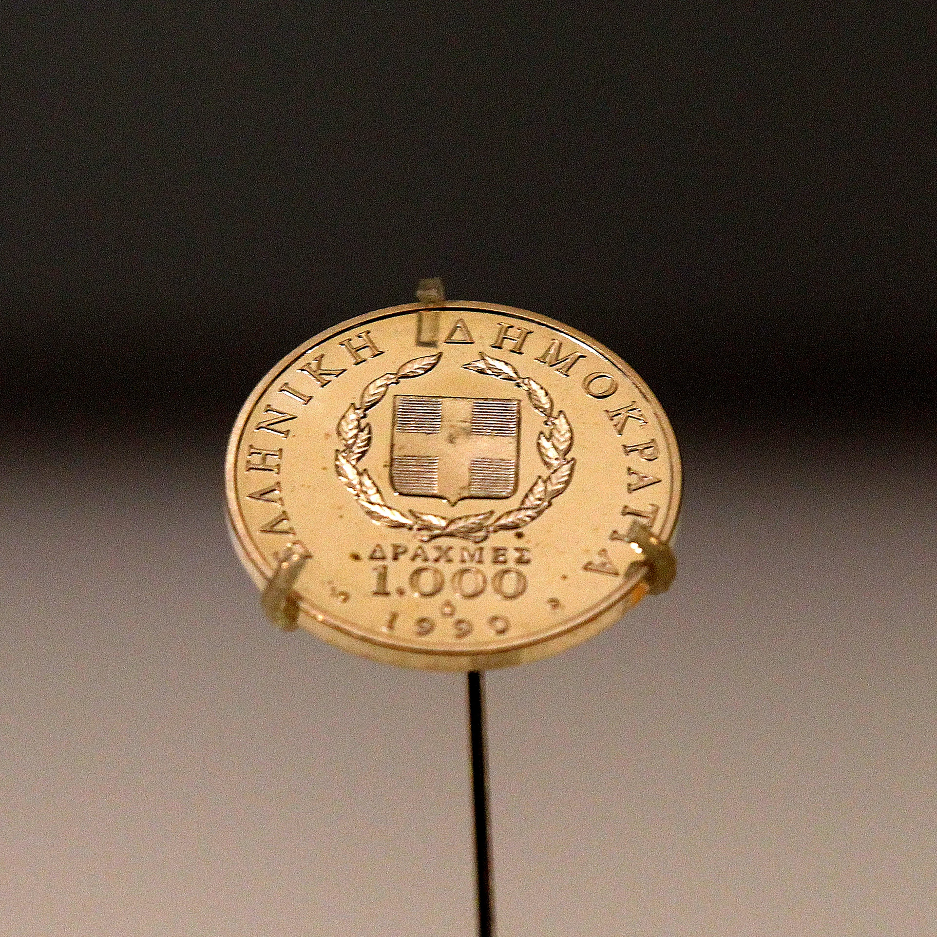 A Greek 1,000 drachma coin dating from 1999, sits on display in a secure cabinet at the Bank of Greece museum in Athens, Greece, on Tuesday, Feb. 14, 2012. European officials ratcheted up the pressure on the Greek government to deliver budget cuts in exchange for a second bailout as they insisted that default is not an option. Photographer: Simon Dawson/Bloomberg via Getty Images
138990488
AUSTERITY, BAILOUT, CURRECY; CURRENCIES, CUTS, ECONOMY, EMEA, EUROPE, FINANCE, FINANCIAL