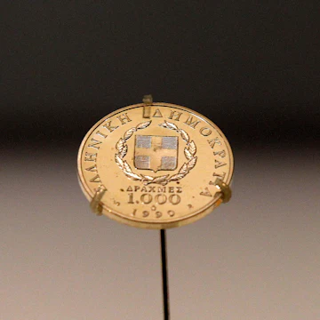 A Greek 1,000 drachma coin dating from 1999, sits on display in a secure cabinet at the Bank of Greece museum in Athens, Greece, on Tuesday, Feb. 14, 2012. European officials ratcheted up the pressure on the Greek government to deliver budget cuts in exchange for a second bailout as they insisted that default is not an option. Photographer: Simon Dawson/Bloomberg via Getty Images
138990488
AUSTERITY, BAILOUT, CURRECY; CURRENCIES, CUTS, ECONOMY, EMEA, EUROPE, FINANCE, FINANCIAL