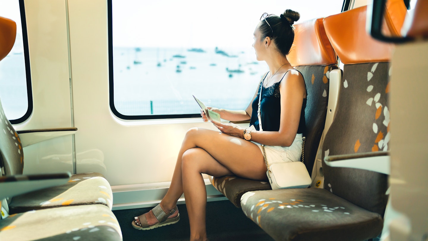Train travel in summer. Young woman on rail trip in Europe. Railway passenger on journey to vacation destination. Girl looking out the window, sea view. Person sitting on subway bench alone.
1395175505
alone, departure, destination, european, female, girl, happy, holiday, interrail, itinerary, lady, lifestyle, metro, person, pretty, rail, railway, ride, sit, space, train, transport, trip, urban, vacation, view, woman, young