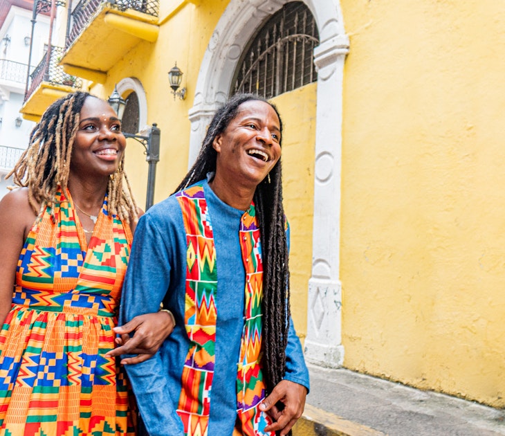 Cute, Fashionable Afro-Descendant Black Tourist Couple Walking Together on Date Night in the Street in Huerta Sandoval Neighborhood of Panama City, Panama
1426692018
A smiling couple walk arm in arm along the street in Panama City
