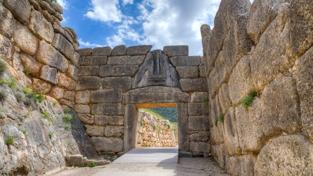 The Lion Gate was the main entrance of the Bronze Age citadel of Mycenae, southern Greece. It was erected during the 13th century BC in the northwest side of the acropolis and is named after the relief sculpture of two lionesses in a heraldic pose that stands above the entrance. The Lion Gate is the sole surviving monumental piece of Mycenaean sculpture, as well as the largest sculpture in the prehistoric Aegean.