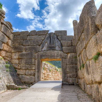 The Lion Gate was the main entrance of the Bronze Age citadel of Mycenae, southern Greece. It was erected during the 13th century BC in the northwest side of the acropolis and is named after the relief sculpture of two lionesses in a heraldic pose that stands above the entrance. The Lion Gate is the sole surviving monumental piece of Mycenaean sculpture, as well as the largest sculpture in the prehistoric Aegean.