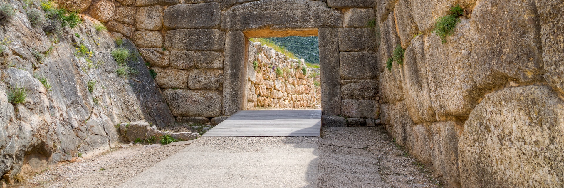 The Lion Gate was the main entrance of the Bronze Age citadel of Mycenae, southern Greece. It was erected during the 13th century BC in the northwest side of the acropolis and is named after the relief sculpture of two lionesses in a heraldic pose that stands above the entrance. The Lion Gate is the sole surviving monumental piece of Mycenaean sculpture, as well as the largest sculpture in the prehistoric Aegean.