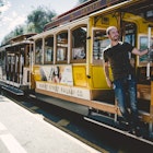 SAN FRANCISCO Ca. - September 26: Passenger ride in a cable car on September 26, 2015 in San Francisco. It is the most popular way to get around the City of San Fransisco.