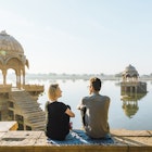 Gadi Sagar lake; she is at a public viewpoint, accessible without entry fee
929466066