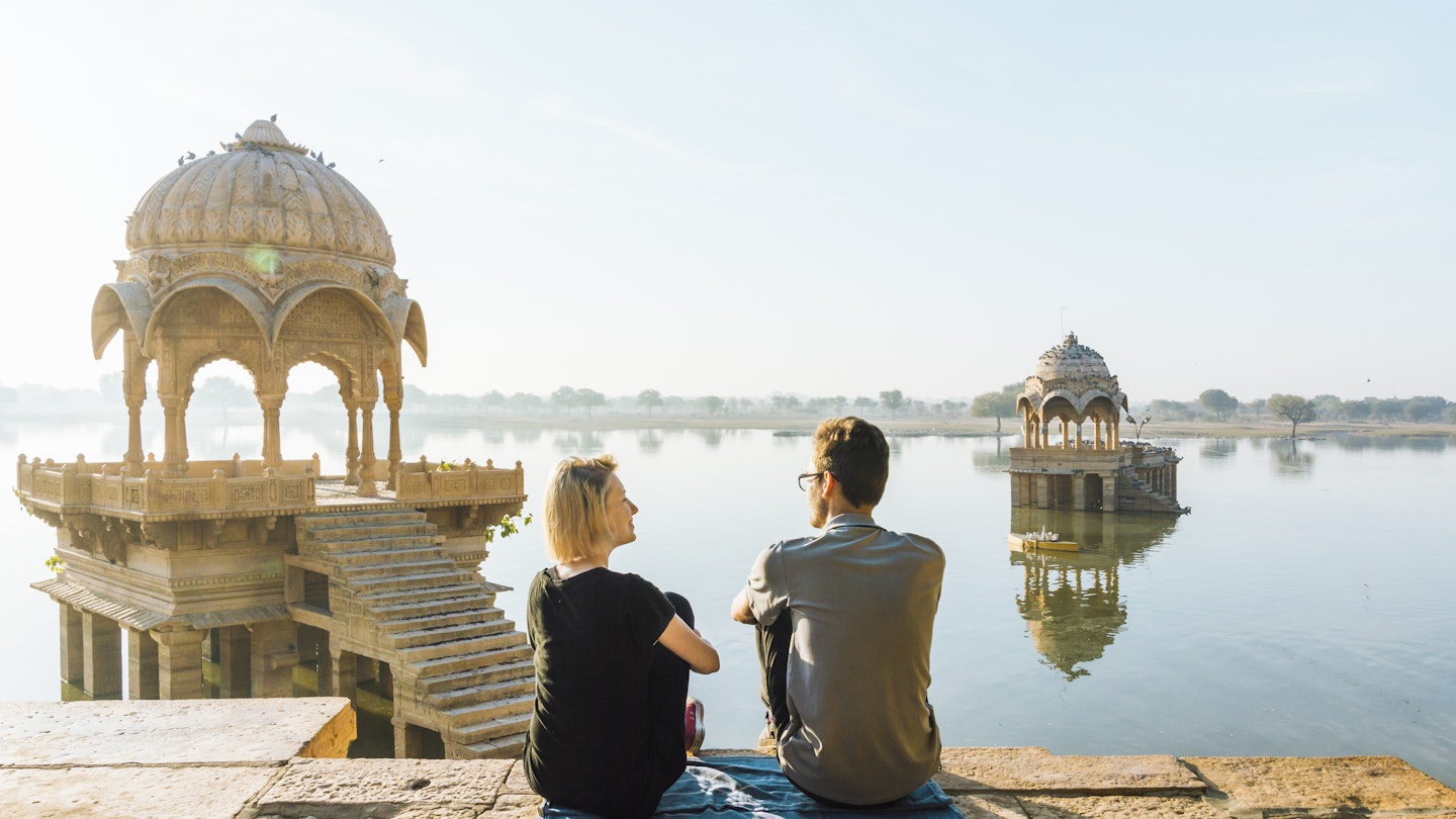 Gadi Sagar lake; she is at a public viewpoint, accessible without entry fee
929466066