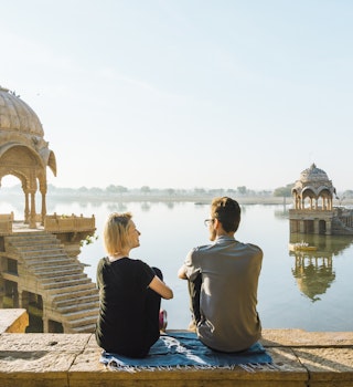 Gadi Sagar lake; she is at a public viewpoint, accessible without entry fee
929466066