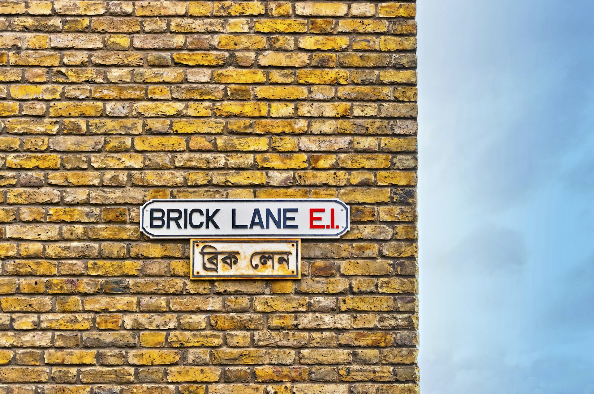 Brick Lane street sign on wall, London Brick Travel Destinations Horizontal Outdoors Multi-Ethnic Group Brick Wall Surrounding UK England Street Old Famous Place International Landmark British Culture Tower Hamlets Wall - Building Feature Brick Lane - Inner London London - England Photography Capital Cities Shoreditch East London Fashionable ©eddygaleotti/Getty Images