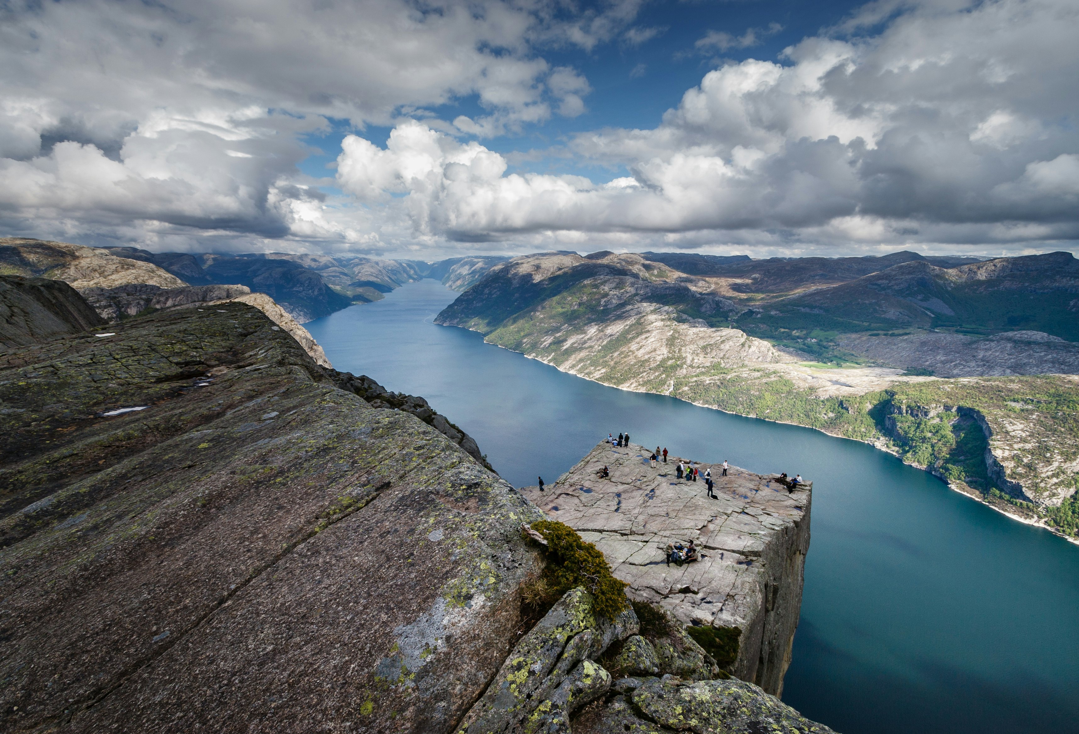 A view of a rocky outcrop in front of the fjords of Norway.