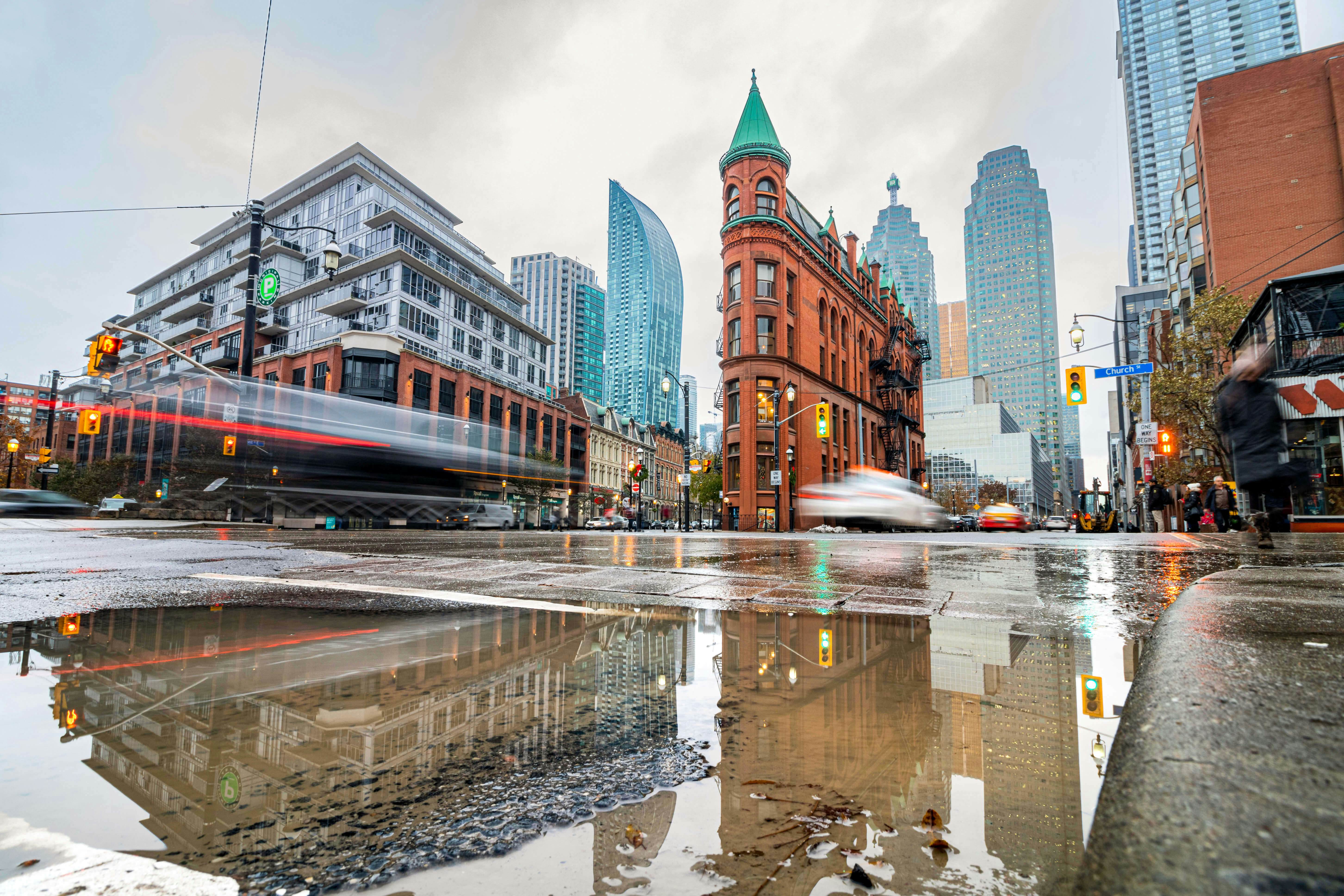 The Gooderham Building (Flatiron), a Romanesque style building, in East Toronto on a rainy day in the Financial District.