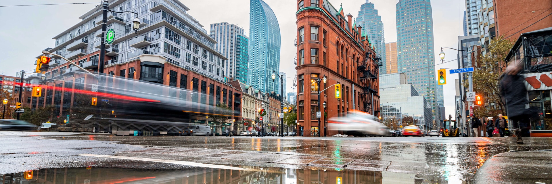 The Gooderham Building (Flatiron), a Romanesque style building, in East Toronto on a rainy day in the Financial District.