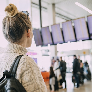 A young woman in Amsterdam waiting at the airport.
823459624