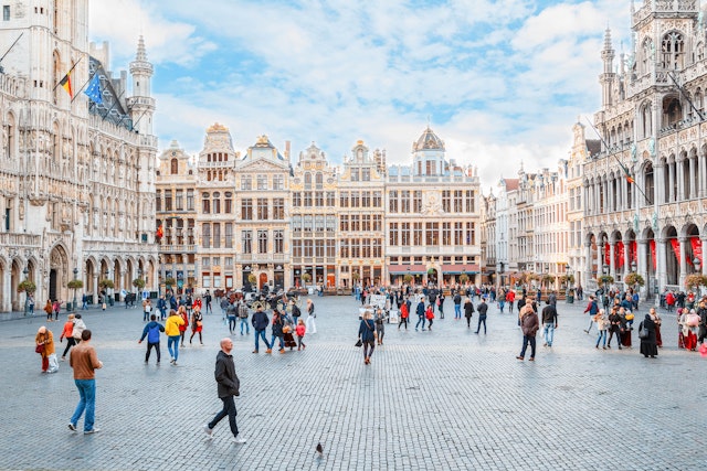 People walk through the Grand Place, Brussels, Belgium