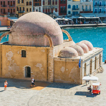23 May 2016: Exterior of the historic mosque in the old port of Chania.
1053739037
aegean, architecture, bay, beautiful, beauty, blue, building, chania, city, cityscape, coast, coastline, crete, europe, european, greece, greek, hania, harbor, harbour, holiday, house, island, landmark, landscape, mediterranean, mosque, nature, old, people, pier, port, quay, scene, scenery, sea, sky, stone, summer, sun, sunny, tourism, tourist, town, travel, venetian, view, water, xania