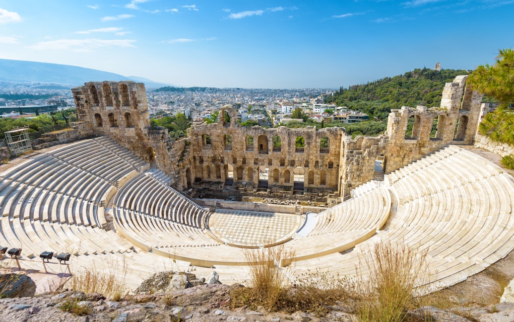 Panoramic view of the Odeon of Herodes Atticus at the Acropolis of Athens, Greece. It is one of the main landmarks of Athens. Scenic panorama of Herod Atticus Odeon overlooking Athens city in summer.
1094872550
acropolis, amphitheater, ancient, antique, architecture, athens, atticus, attraction, beautiful, building, cityscape, civilization, classical, concert, culture, destinations, europe, famous, greece, greek, hellenic, herodeon, herodes, hill, historical, landmark, landscape, monument, museum, music, odeon, old, outdoor, performance, place, ruins, scene, scenery, skyline, stage, stone, structure, sunny, theater, theatre, tourism, tourist, tragedy, travel, unesco