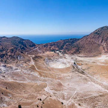 Aerial of the Stefanos volcano crater on Nisyros Island, with the Aegean sea in the background.
1513319564
aegean, aerial, cliff, crater, dodecanese, drone, greece, island, landscape, mountain, nature, nisyros, photo, rock, rocky, sea, stefanos, volcano