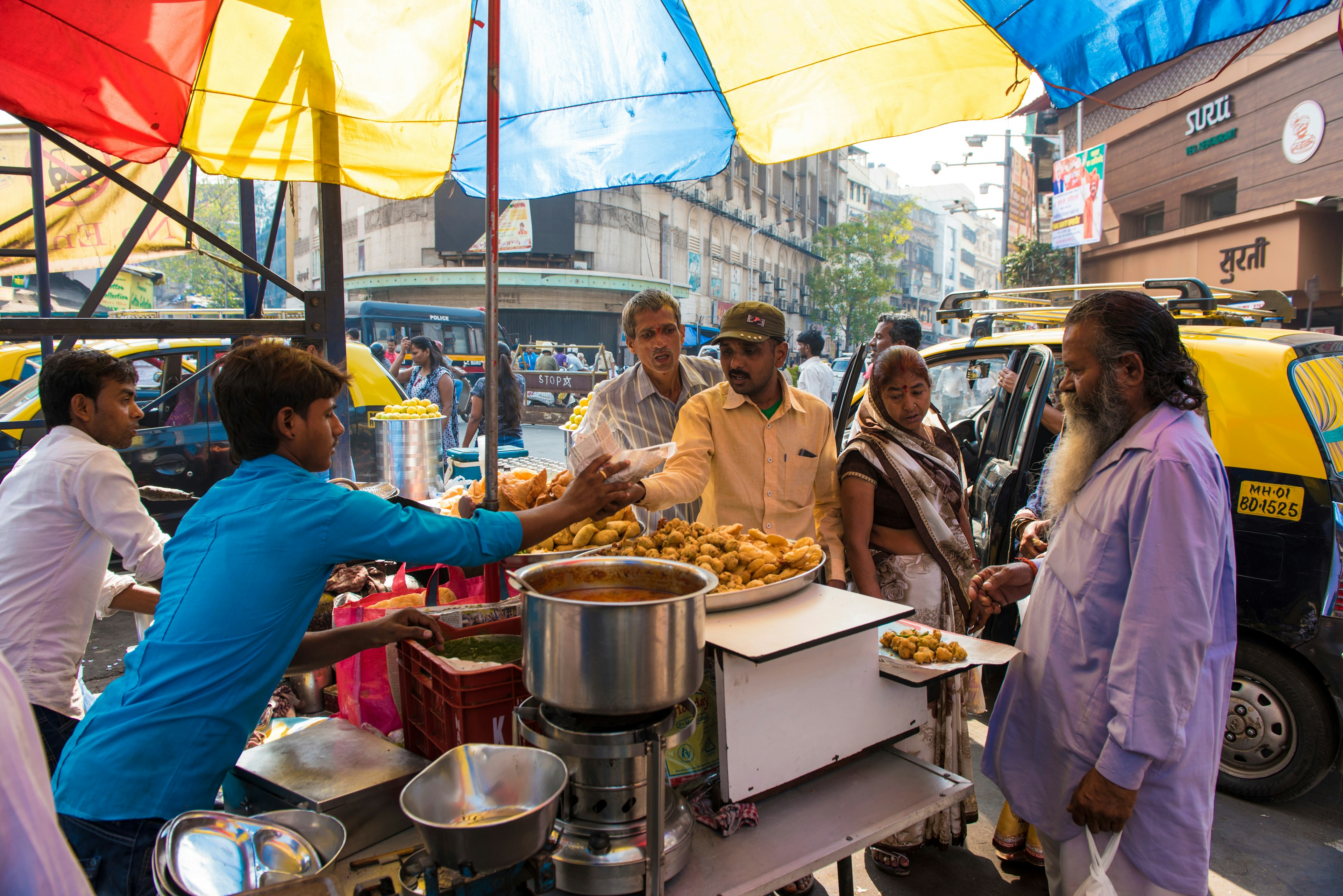 Vendors selling fried food snacks at Kalbadevi, Mumbai.