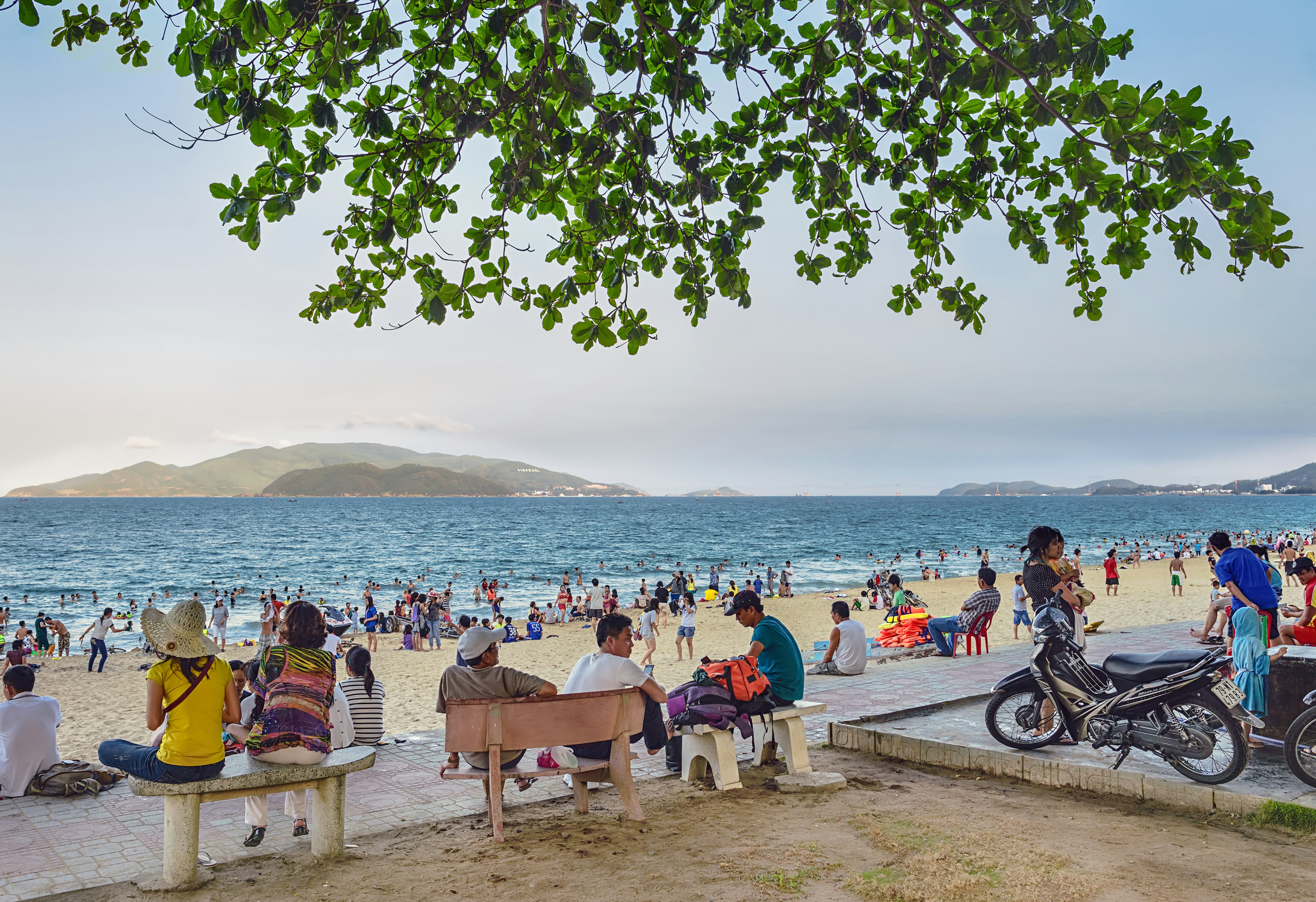 Local people gather at a Nha Trang beach.