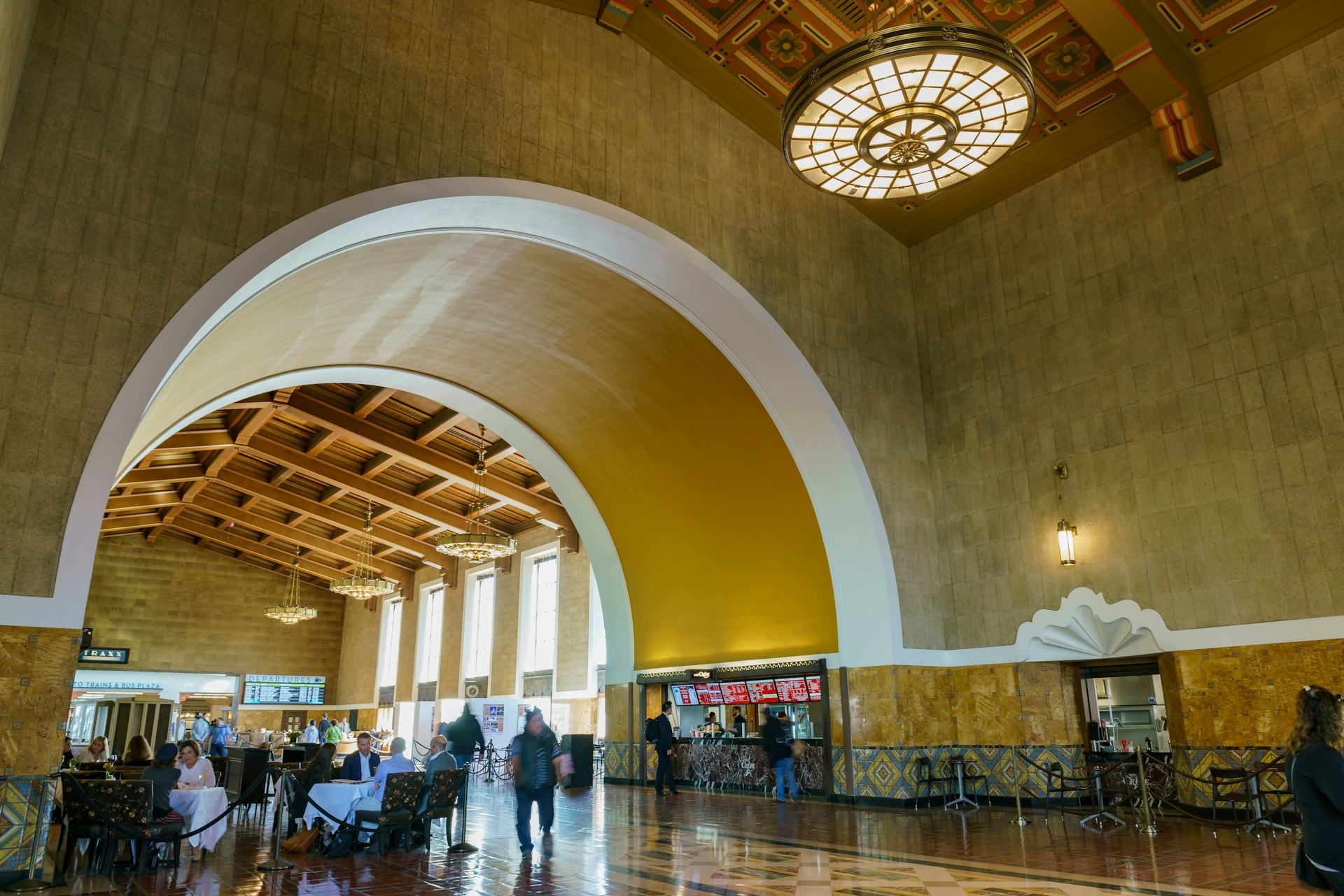 People in the grand waiting room at Union Station, Los Angeles, California, USA