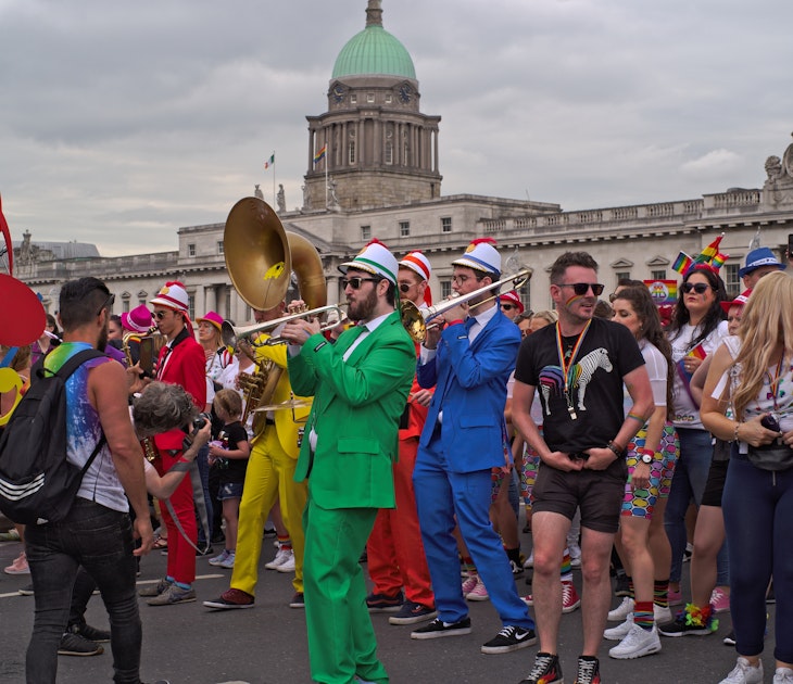 DUBLIN, IRELAND - JUNE 29, 2019: Musicians in colorful costumes play for people in the Dublin LGBTQ Pride Festival in 2019. The Custom House landmark building in the background.; Shutterstock ID 1438317050; your: Brian Healy; gl: 65050; netsuite: Lonely Planet Online Editorial; full: Skip St Patty's for Dublin Pride
1438317050