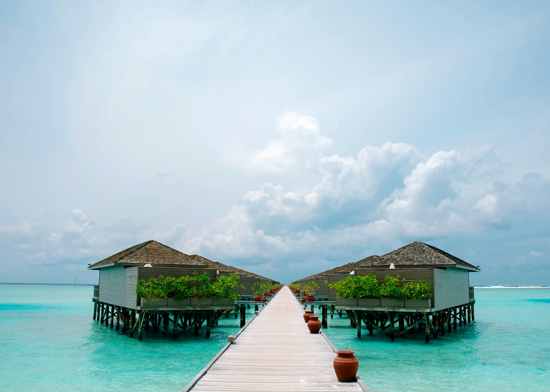 A boardwalk to the overwater villas at Meeru Island Resort, Maldives