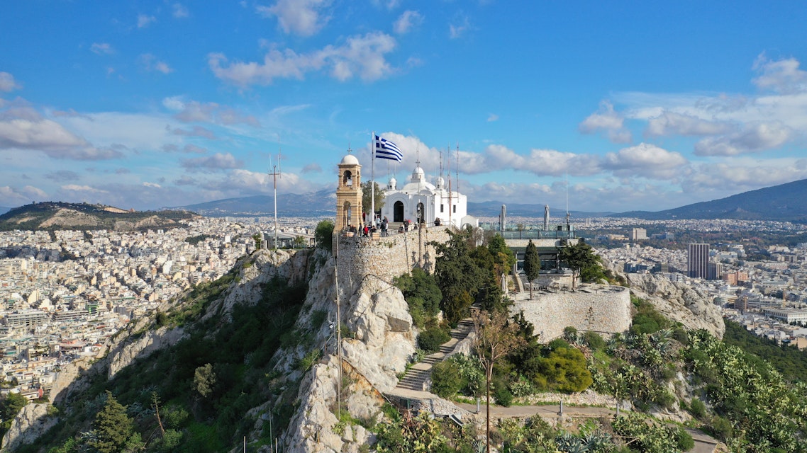 Aerial drone photo of iconic chapel of Saint George on top of Lycabettus hill with beautiful deep blue sky and clouds, Athens, Attica, Greece; Shutterstock ID 1614107947; your: Erin Lenczycki; gl: 65050; netsuite: Digital; full: POI
1614107947