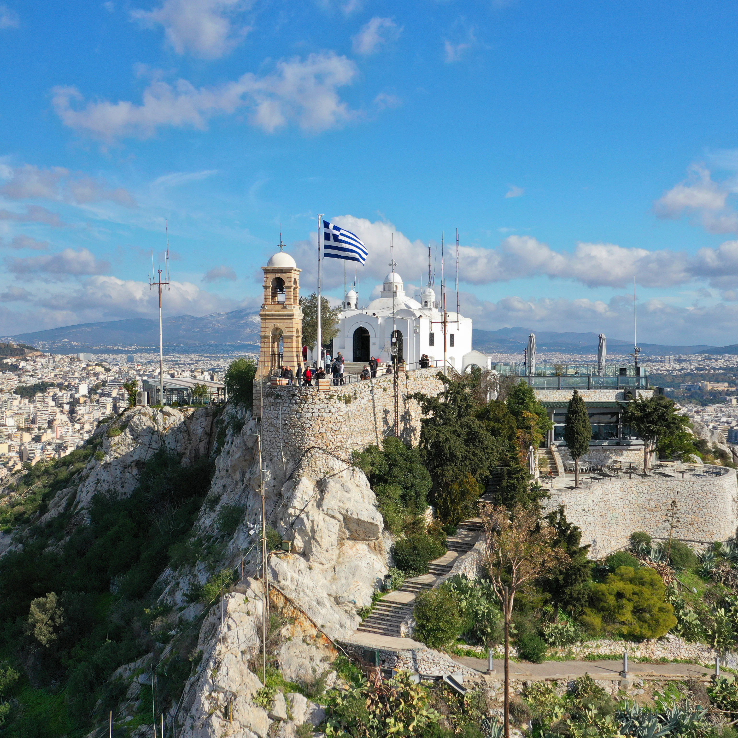 Aerial drone photo of iconic chapel of Saint George on top of Lycabettus hill with beautiful deep blue sky and clouds, Athens, Attica, Greece; Shutterstock ID 1614107947; your: Erin Lenczycki; gl: 65050; netsuite: Digital; full: POI
1614107947