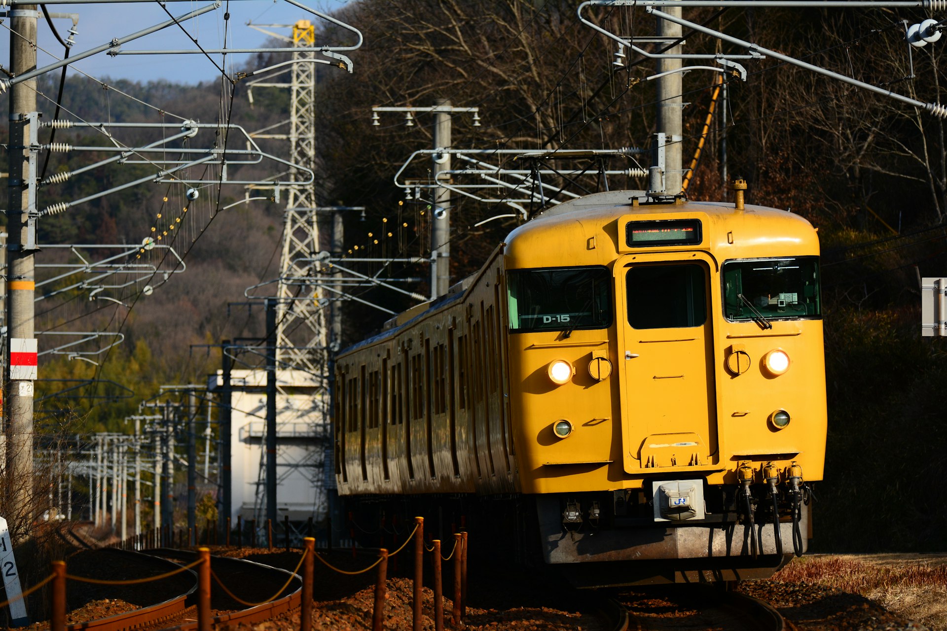 A yellow-painted 115 series commuter train, Japan