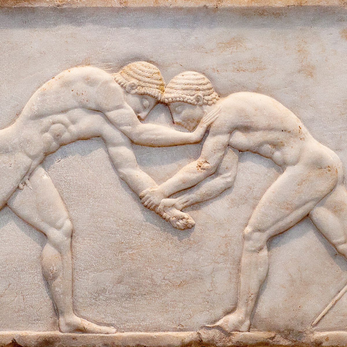 Ancient bas-relief on grave stele in Kerameikos with scene from Palaestra - wrestlers in action. On the left an athlete is ready to jump, on the right another one prepairing the pit. Athens, Greece; Shutterstock ID 1745203673; your: Erin Lenczycki; gl: 65050 ; netsuite: Digital; full: Digital
1745203673