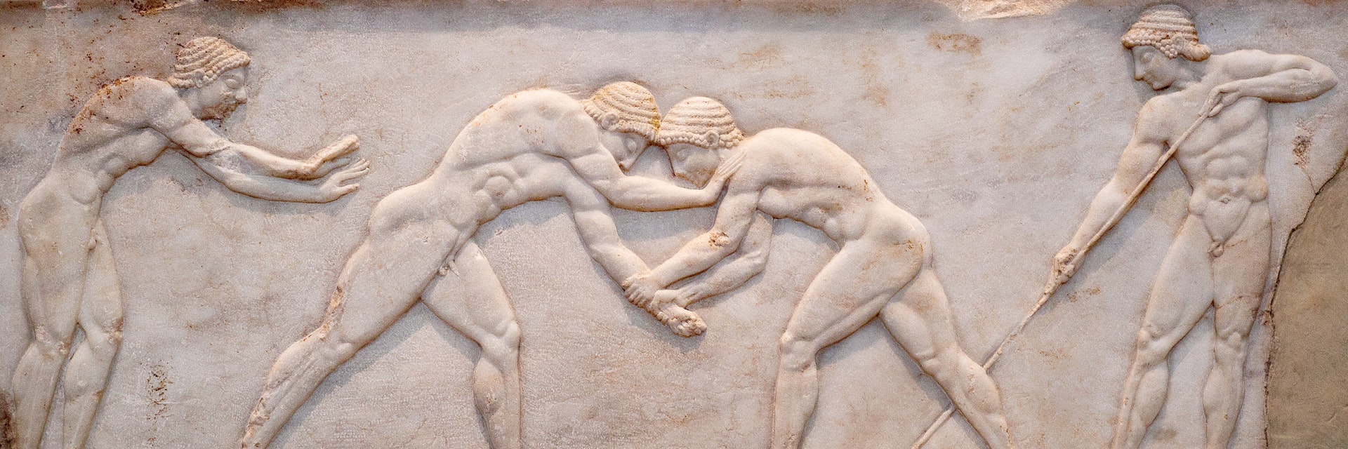 Ancient bas-relief on grave stele in Kerameikos with scene from Palaestra - wrestlers in action. On the left an athlete is ready to jump, on the right another one prepairing the pit. Athens, Greece; Shutterstock ID 1745203673; your: Erin Lenczycki; gl: 65050 ; netsuite: Digital; full: Digital
1745203673