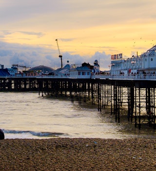 A man proposes to his fiance on the beach beside Brighton Pier, UK; Shutterstock ID 1759258061; your: Claire N; gl: 65050; netsuite: Online ed; full: london day trips
1759258061