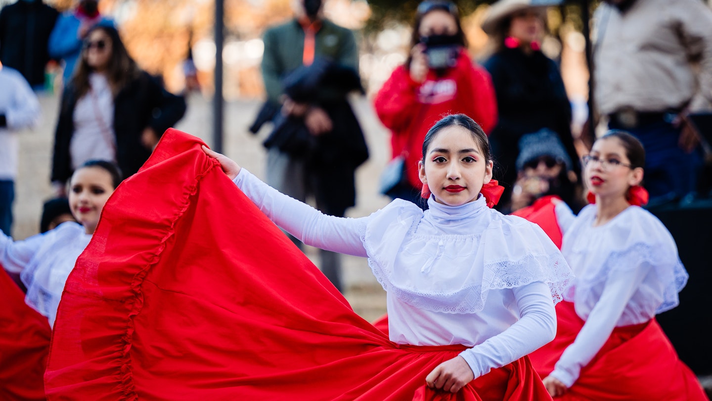 SAN ANTONIO, TEXAS - FEBRUARY 8, 2022: young folklorico dancer entertaining on street; Shutterstock ID 2125186616; your: Brian Healy; gl: 65050; netsuite: Lonely Planet Online Editorial; full: Best time to visit San Antonio
2125186616