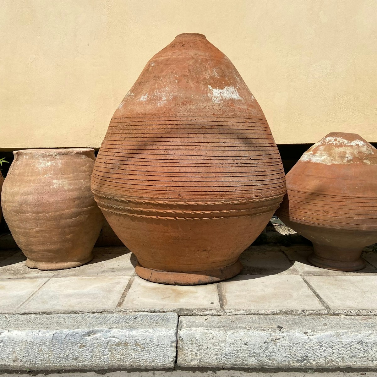 A row of pottery in different shapes and sizes lined up outside against the wall of a museum in the Keramikos neighborhood of Athens, Greece; Shutterstock ID 2222064069; your: Erin Lenczycki; gl: 65050; netsuite: Digital; full: POI
2222064069