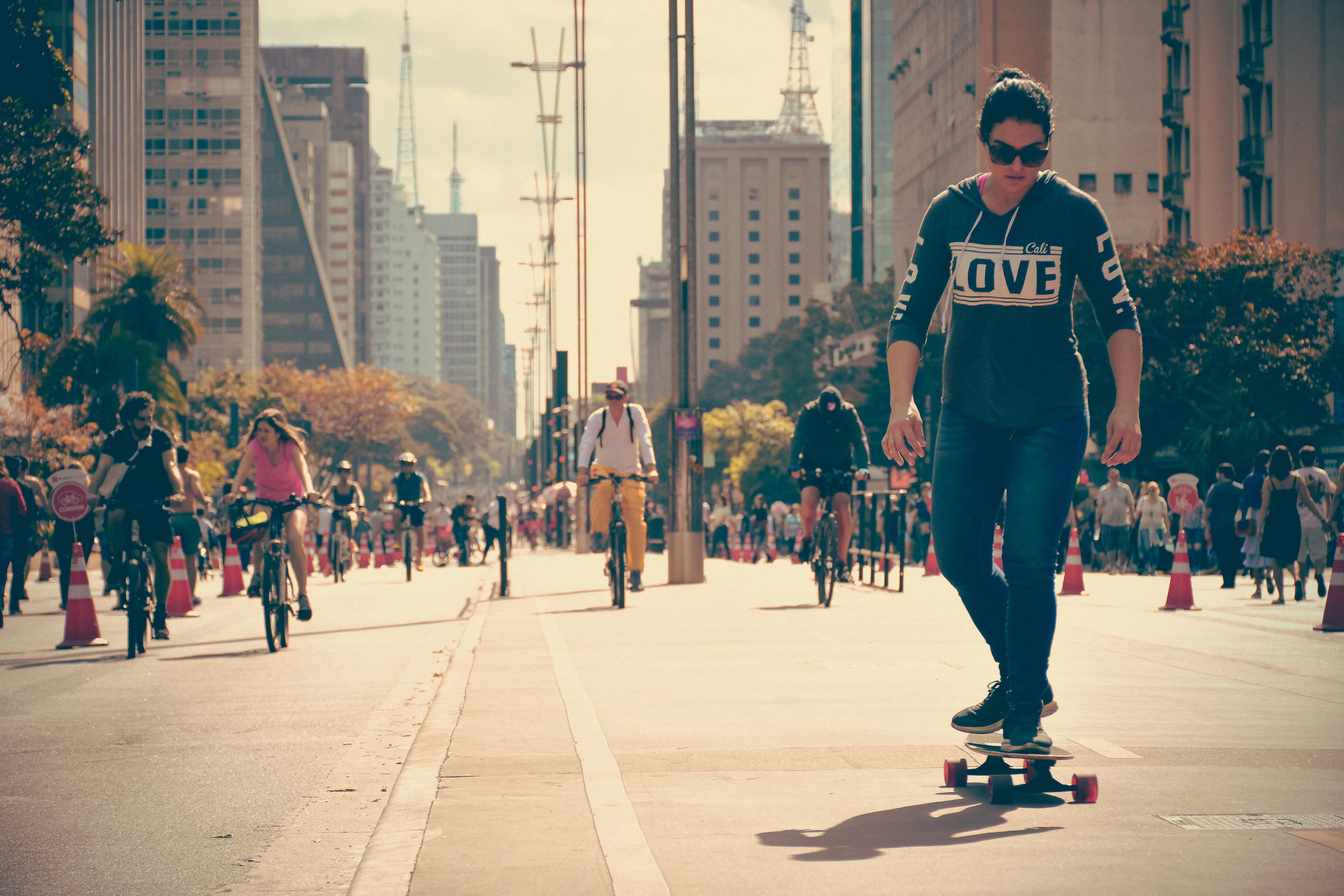 Avenida Paulista in Brazil closed for leisure with people walking and riding bikes.