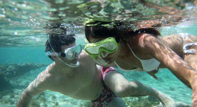 Couple snorkeling in Caribbean waters; Shutterstock ID 99681071; your: Brian Healy; gl: 65050; netsuite: Lonely Planet Online Editorial; full: Best places in Caribbean for couples
99681071
