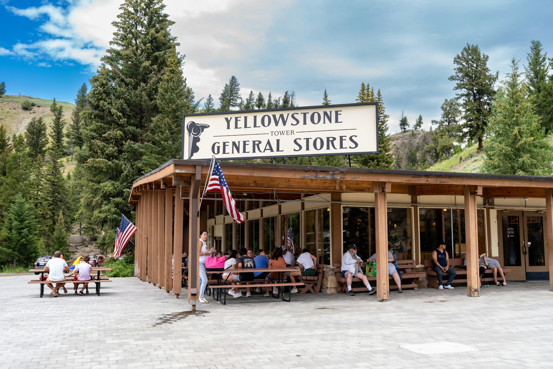 People mingle outside of the Yellowstone Tower Falls General Store in Yellowstone National Park