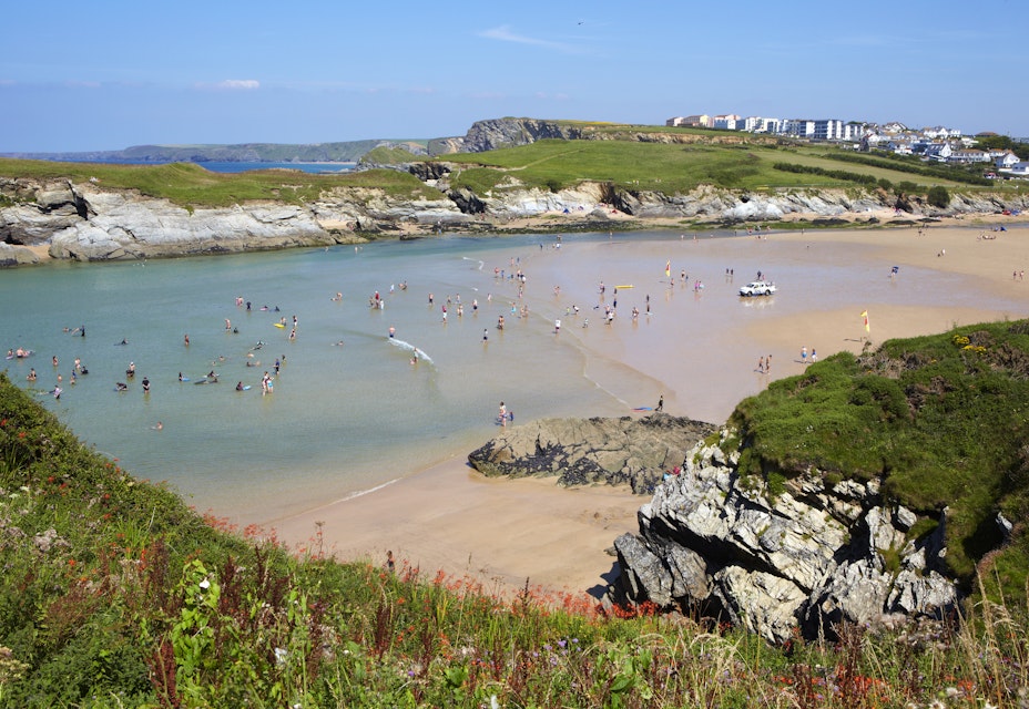 Tourists, swimmers and holidaymakers at Lusty Glaze Beach along the Cornish Coastline