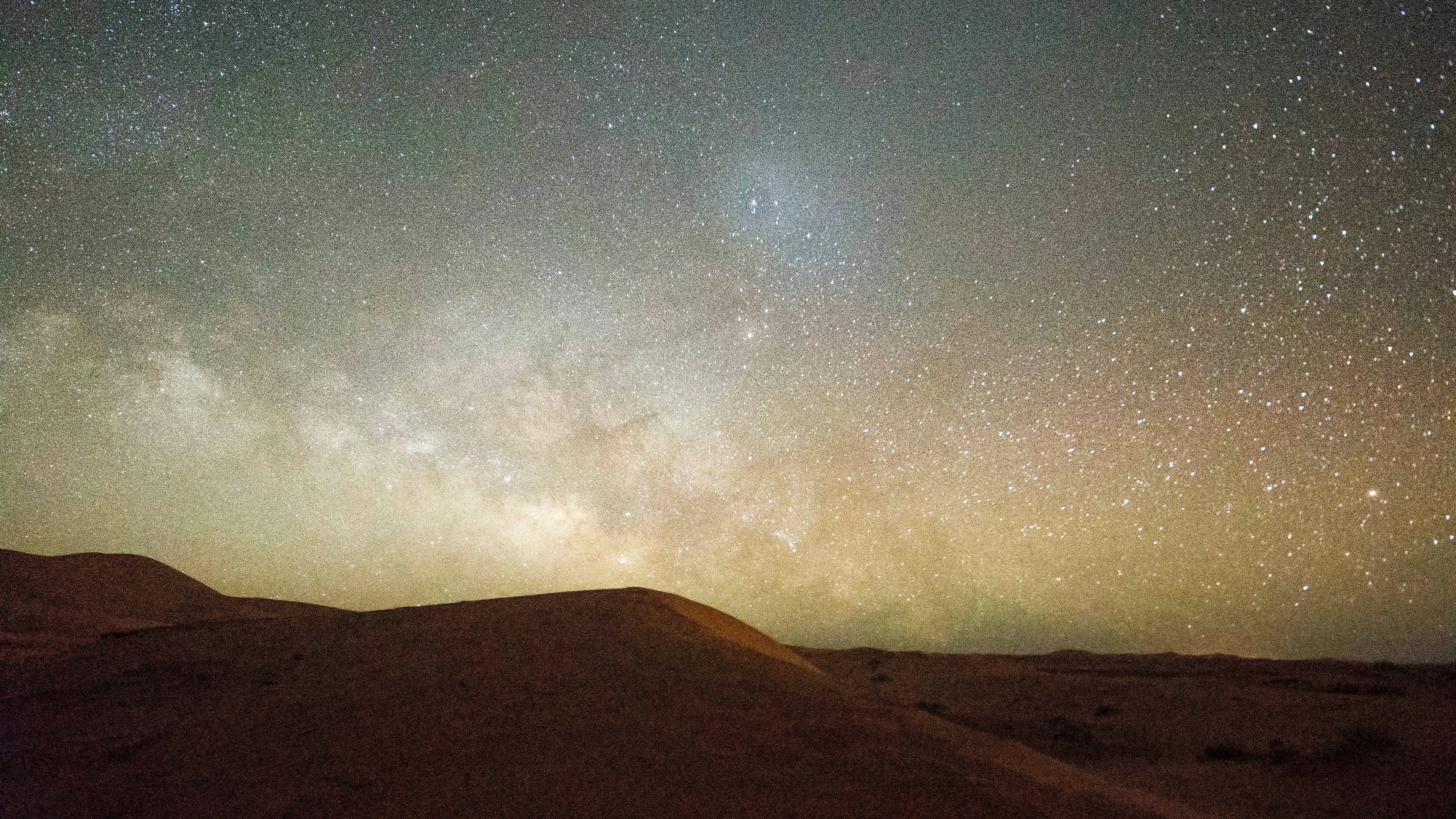 A desert sky at night, filled with stars