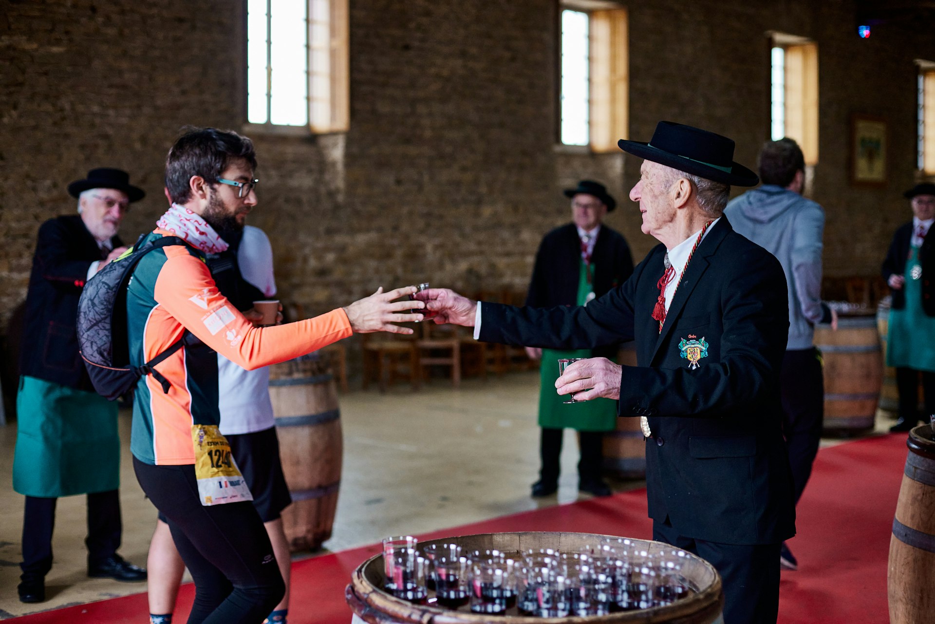 Beaujolais Wine Marathon participants enjoy a glass of wine after their race