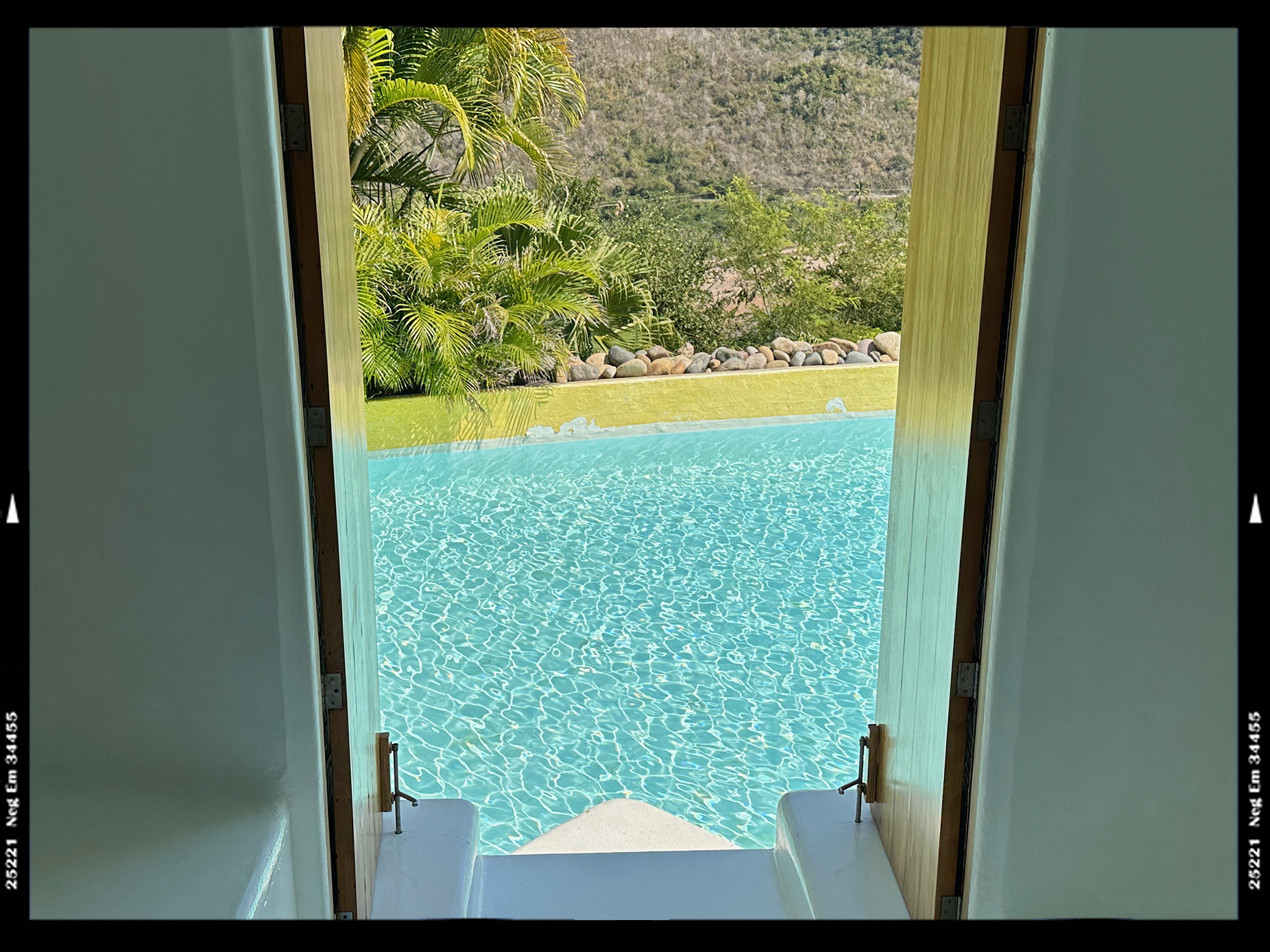Doorway opening out into swimming pool