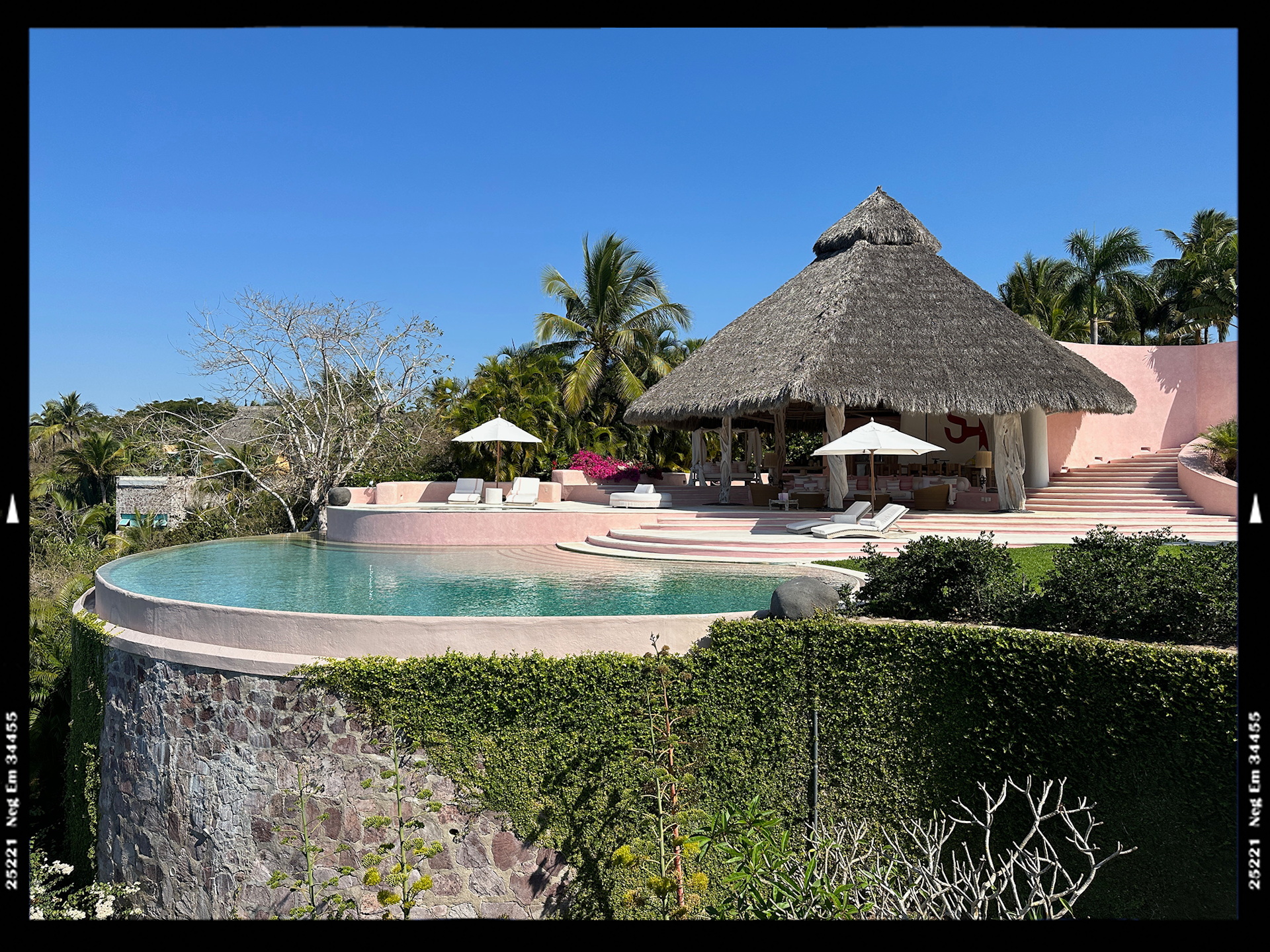 Costa Careyes pink pool and sun loungers 2.png