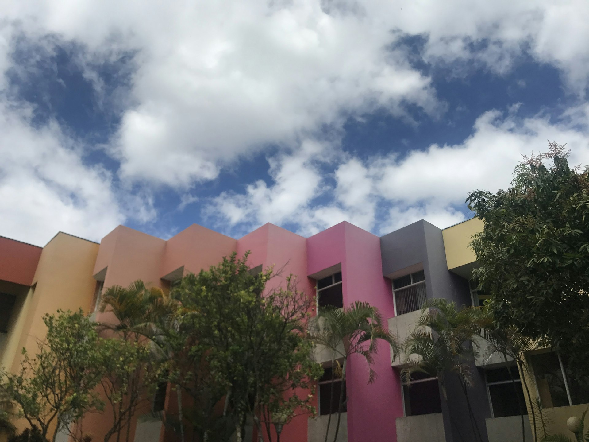 A row of colorful buildings against a blue sky