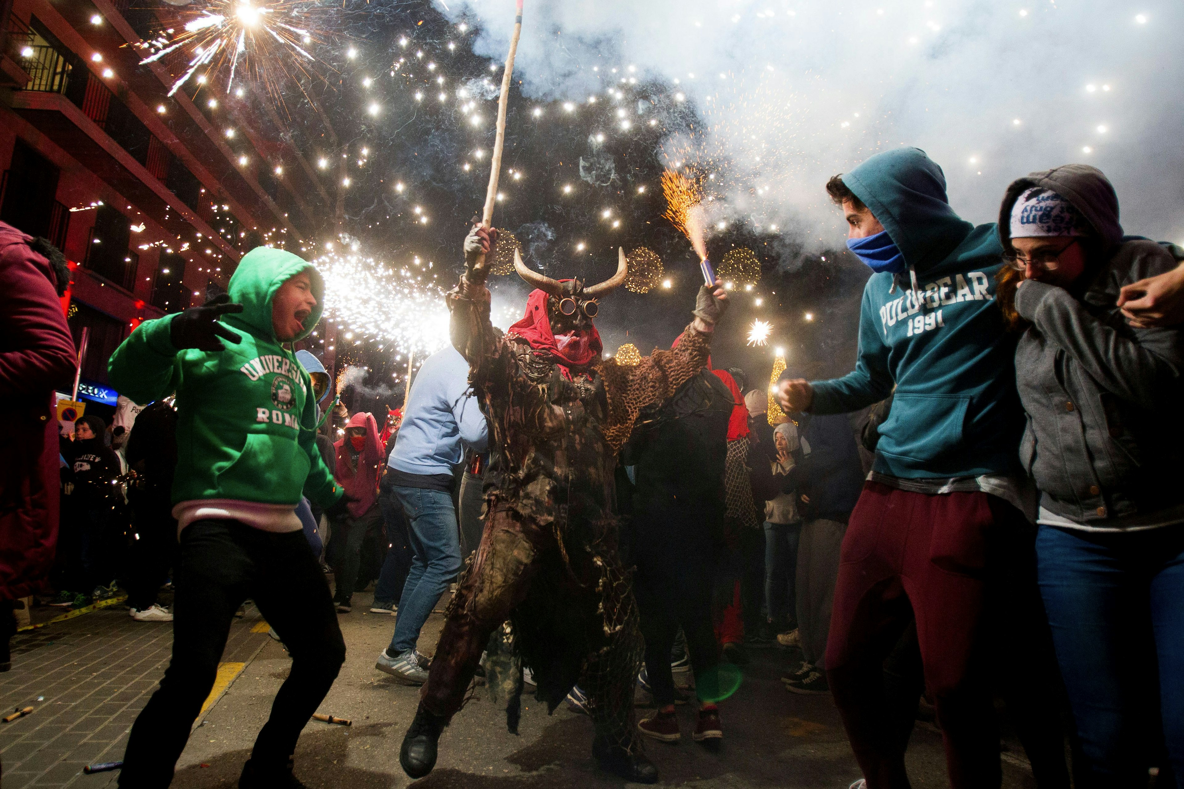 Revelers participate in correfocs (fire runs). Jaime Reina/AFP via Getty Images