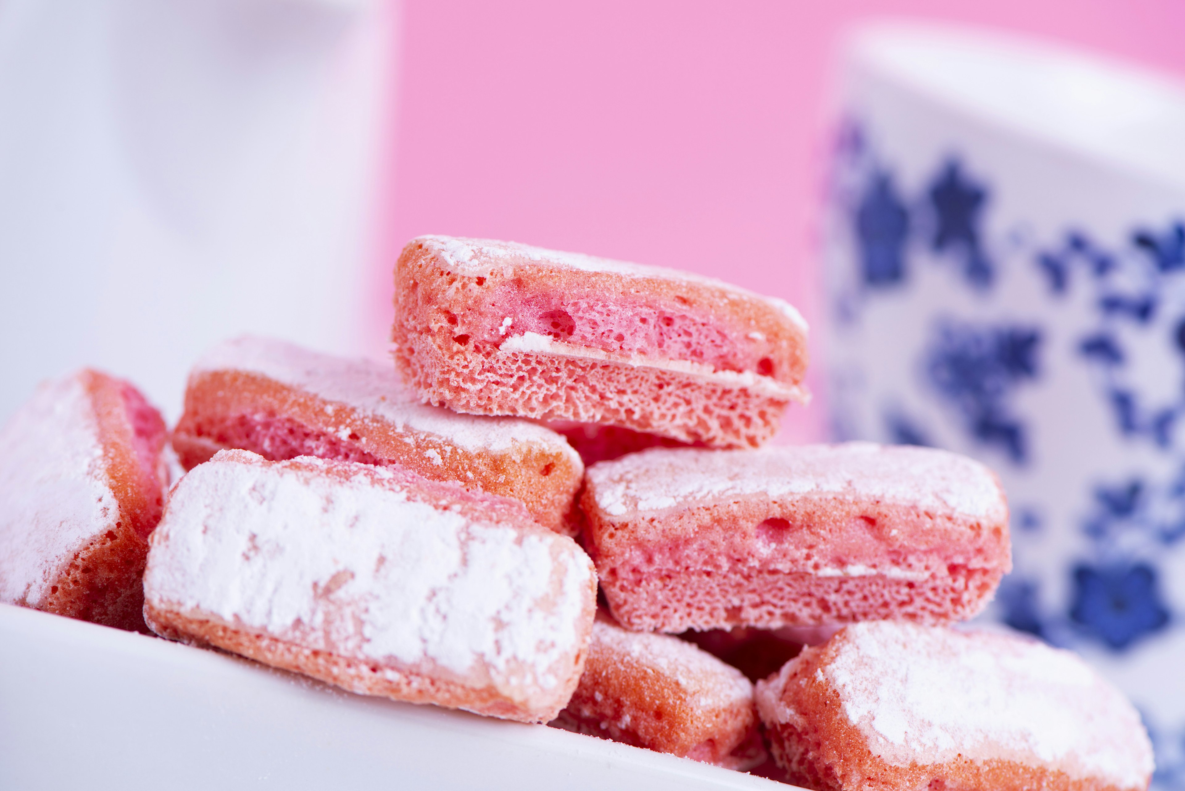 A pile of pink Biscuits roses de Reims on a plate