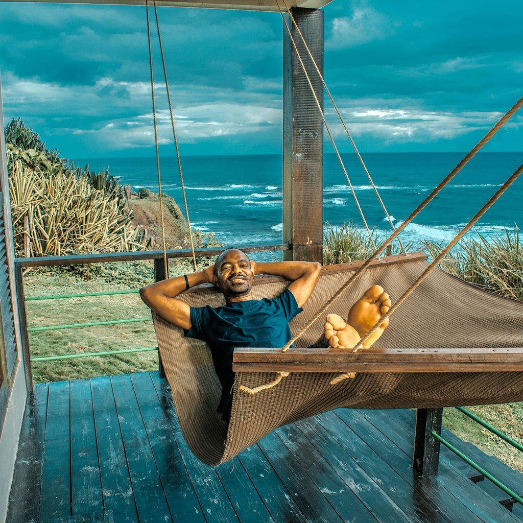 Photo taken in Long Bay, Jamaica
1172505249
A man relaxing on a hammock in Long Bay, Jamaica