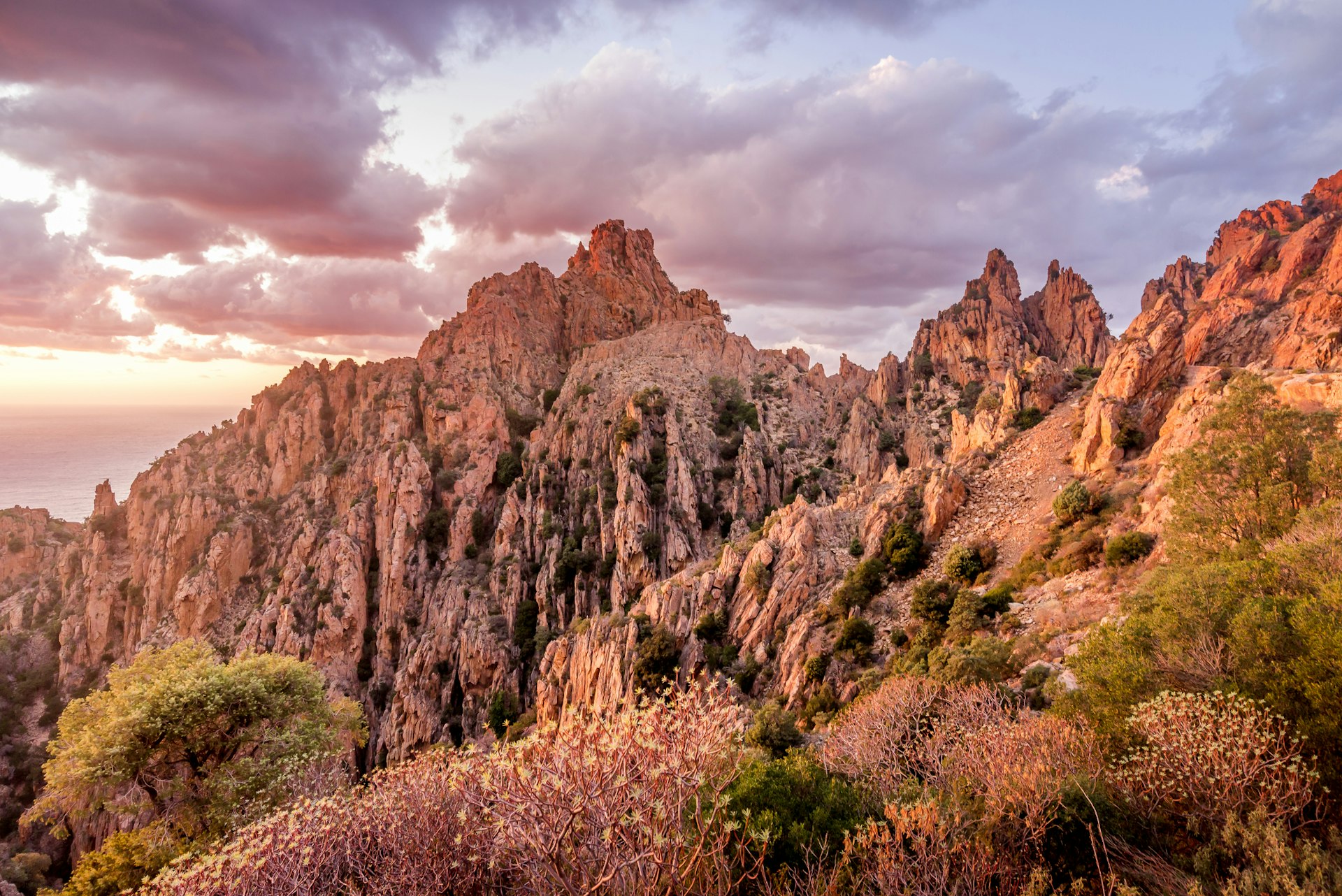 The calanques of Piana, amazing rock formations colored red at sunset in Corsic