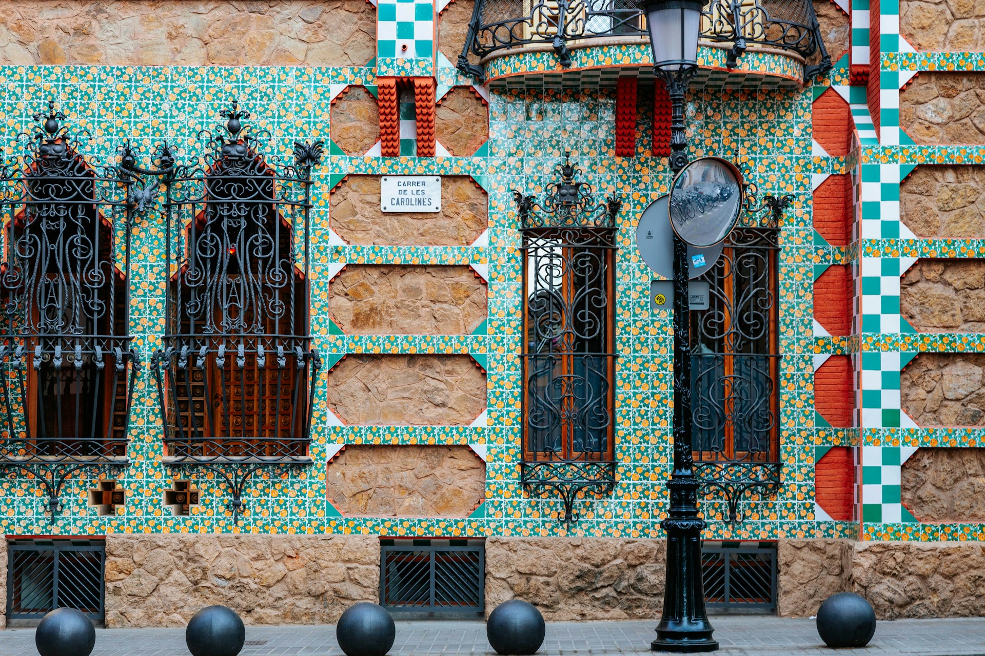 Colorful tiles on a historic wall in Barcelona at Casa Vicens. 