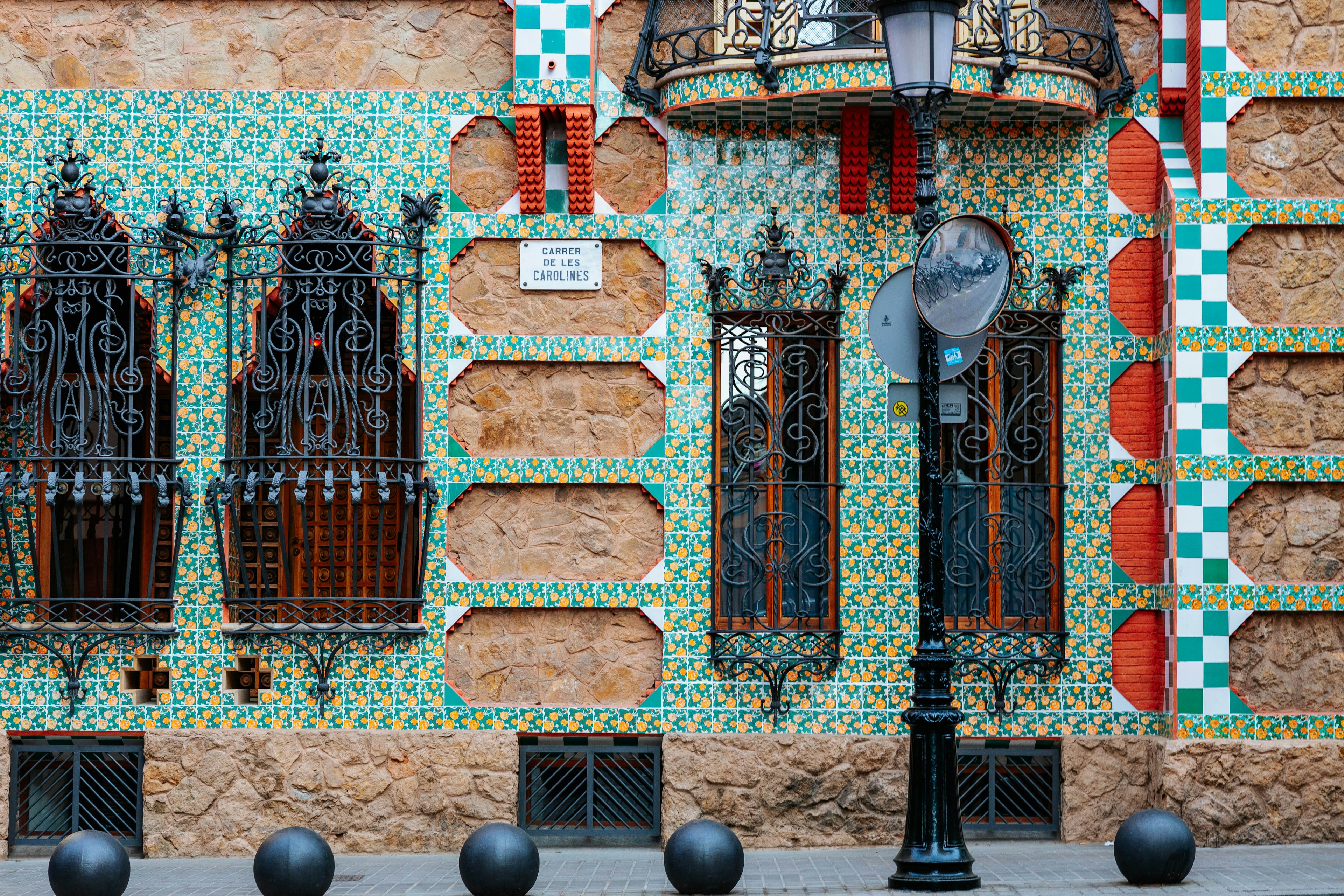 Colorful tiles on a historic wall in Barcelona at Casa Vicens.