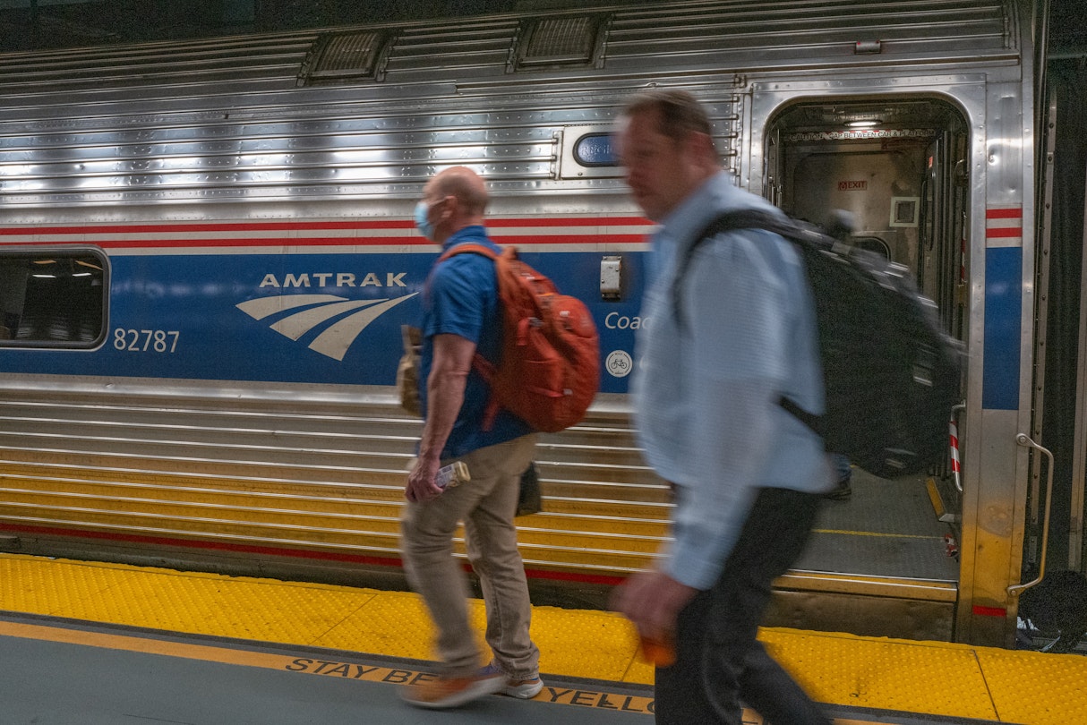 People walk to an Amtrak train in the Moynihan Train Hall on September 15, 2022 in New York City.